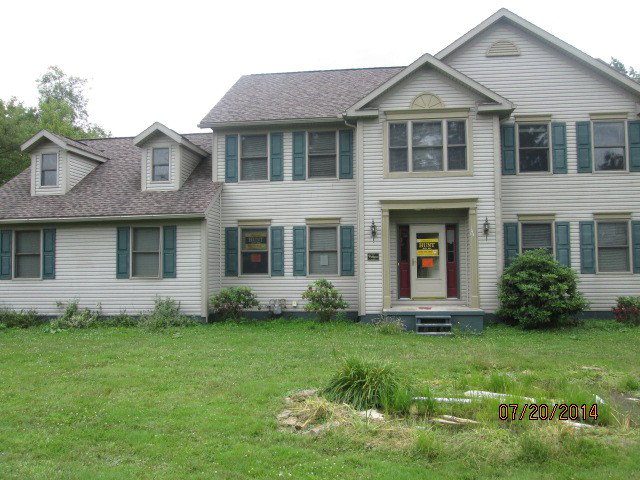 1443 Pittsburgh Road Franklin, PA 16323 - Photo 1 of 1 a front view of a house with a yard