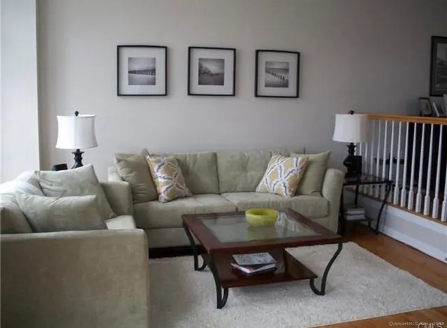 a living room with furniture and a rug