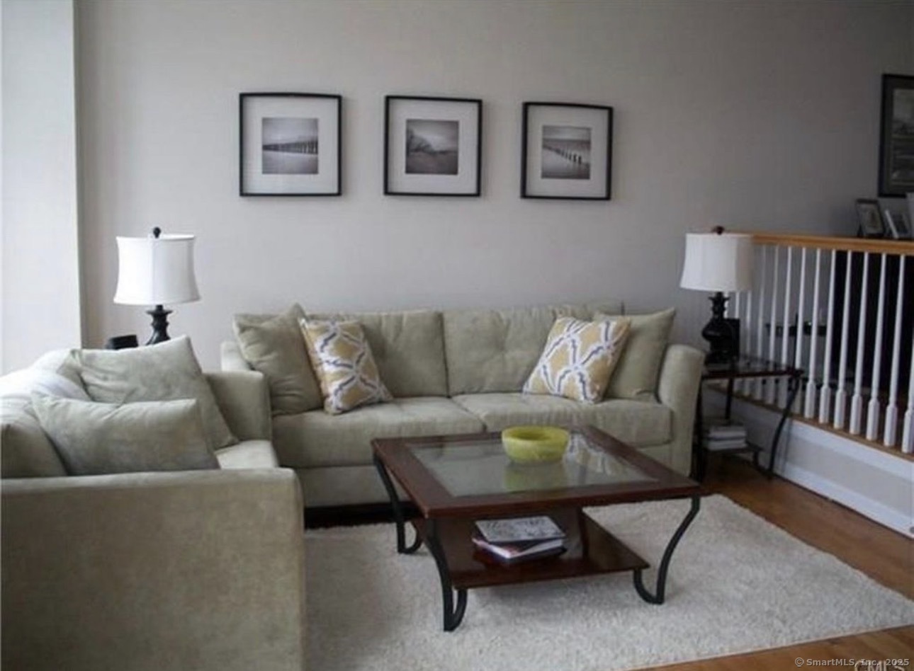 926 Quinnipiac Avenue, Unit 1 New Haven, CT 06513 - Photo 4 of 10 a living room with furniture and a rug