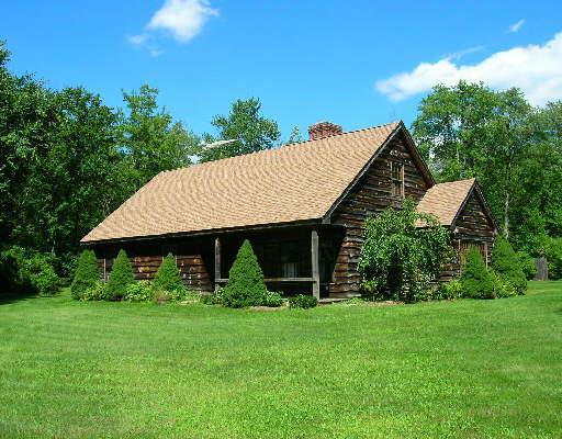 a view of a house with garden and yard