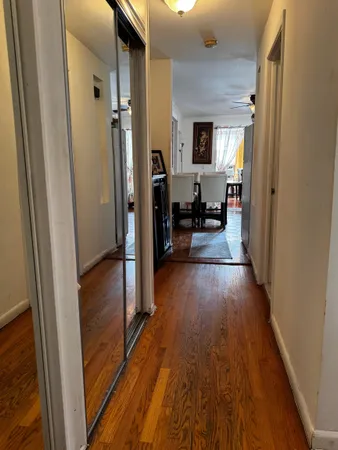 a view of a living room and hardwood floor