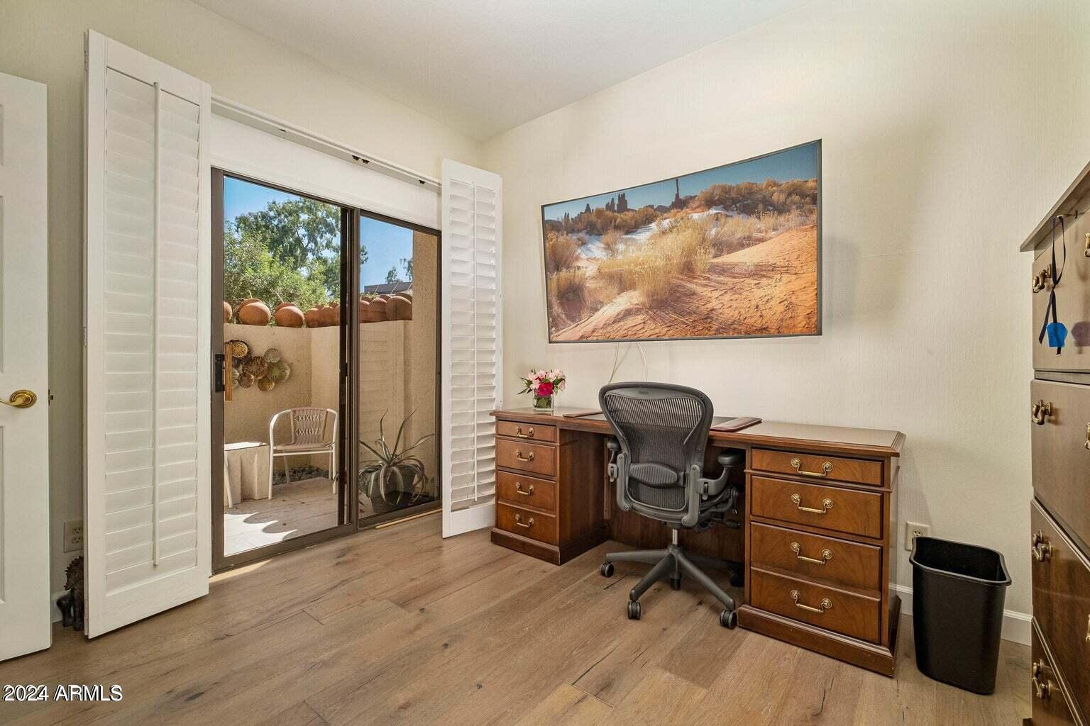 7272 East Gainey Ranch Road, Unit 43 Scottsdale, AZ 85258 - Photo 12 of 40 a view of a workspace with furniture and a window