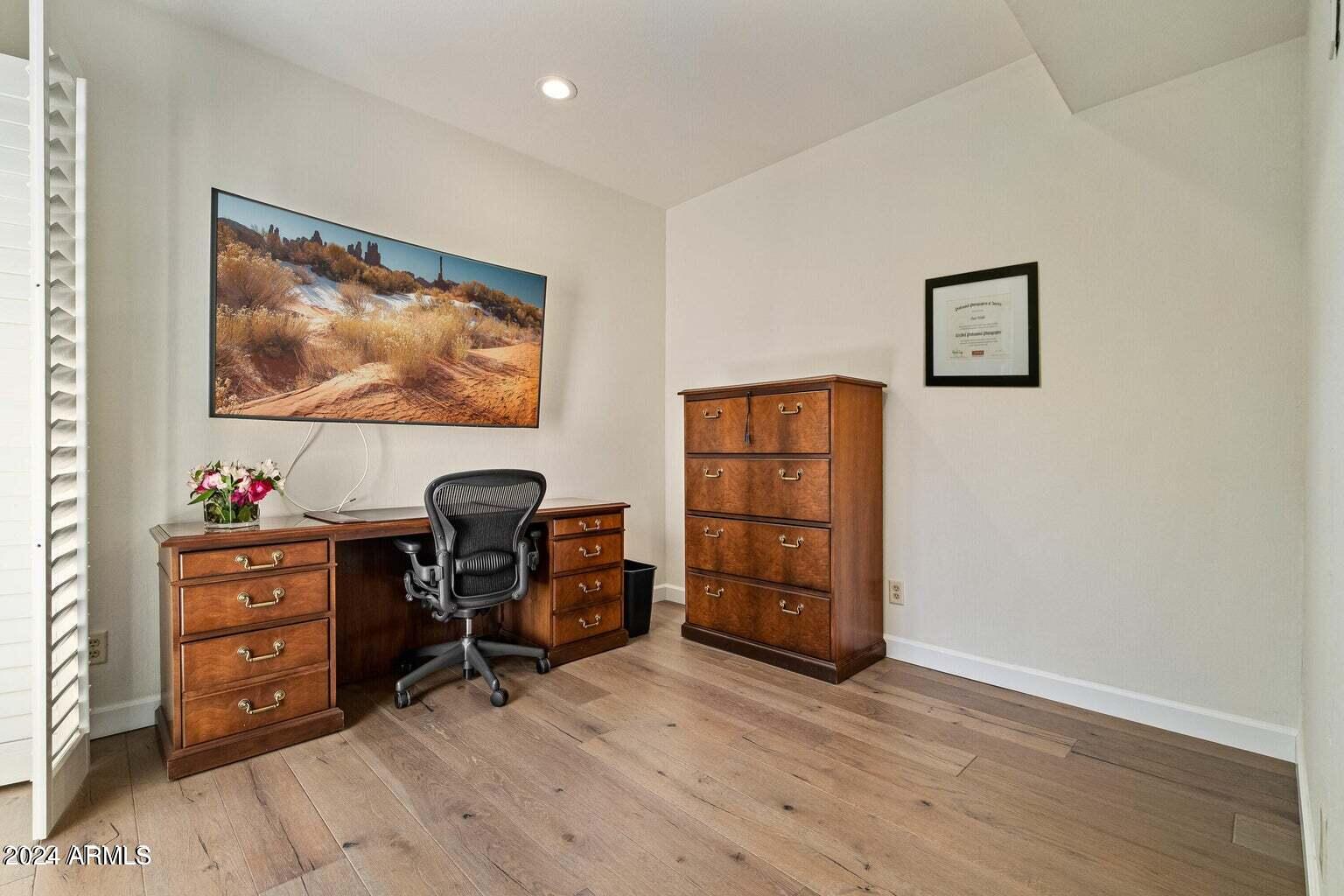 7272 East Gainey Ranch Road, Unit 43 Scottsdale, AZ 85258 - Photo 13 of 40 a view of workspace with wooden floor and furniture