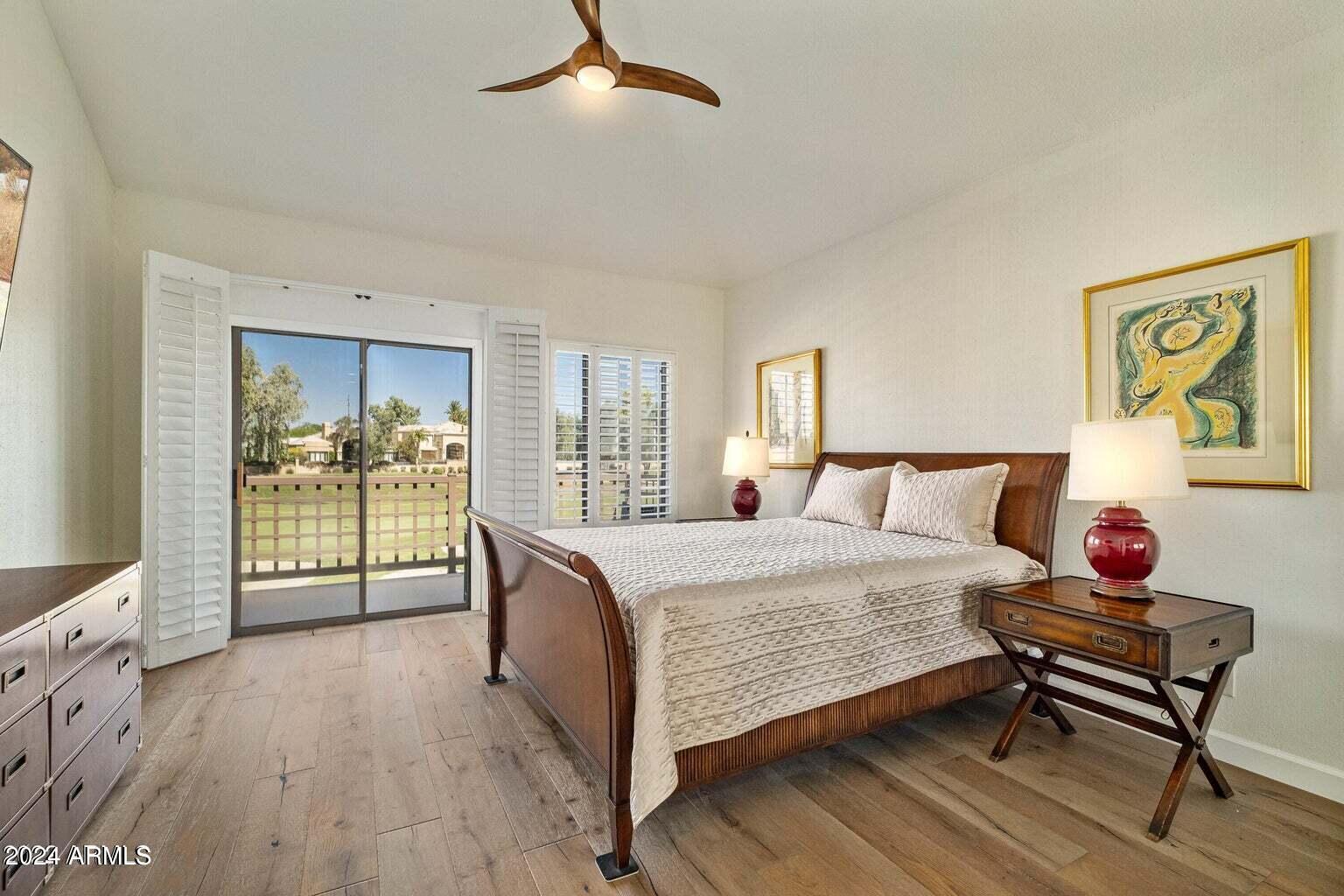 7272 East Gainey Ranch Road, Unit 43 Scottsdale, AZ 85258 - Photo 17 of 40 a bed room with a bed and a chair