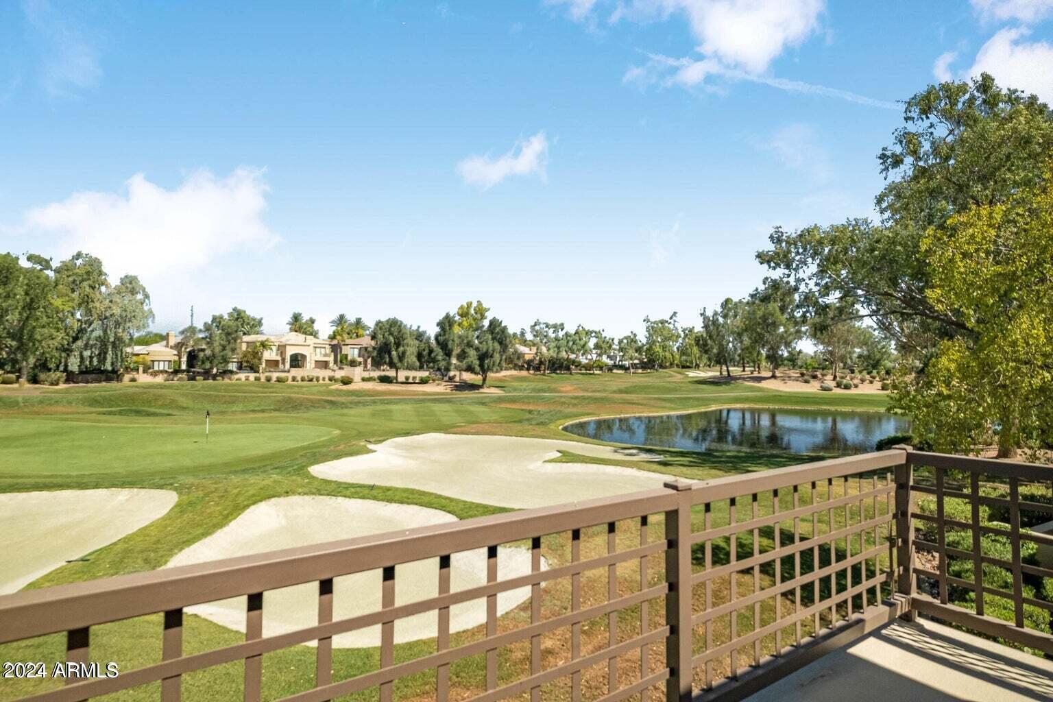 7272 East Gainey Ranch Road, Unit 43 Scottsdale, AZ 85258 - Photo 18 of 40 a view of lake with a yard