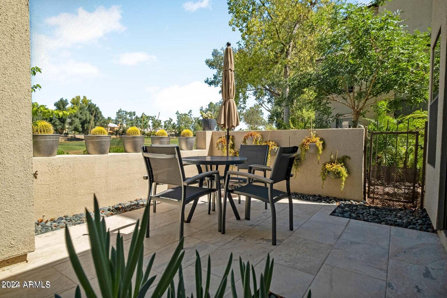 7272 East Gainey Ranch Road, Unit 43 Scottsdale, AZ 85258 - Photo 25 of 40 a view of an outdoor space with seating area