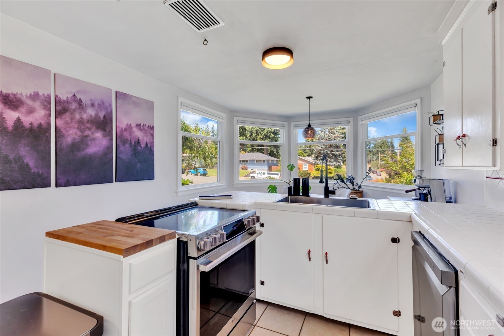 804 Electron Way Fircrest, WA 98466 - Photo 12 of 37 a kitchen that has a sink and a stove in it