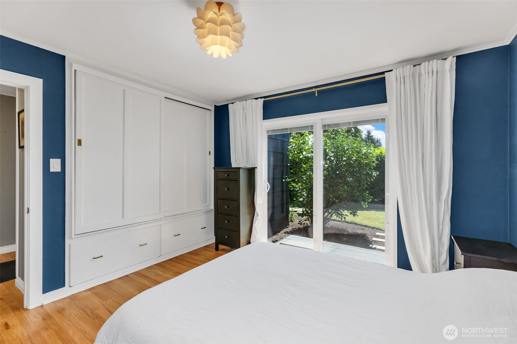 804 Electron Way Fircrest, WA 98466 - Photo 16 of 37 a bedroom with a bed and a large window