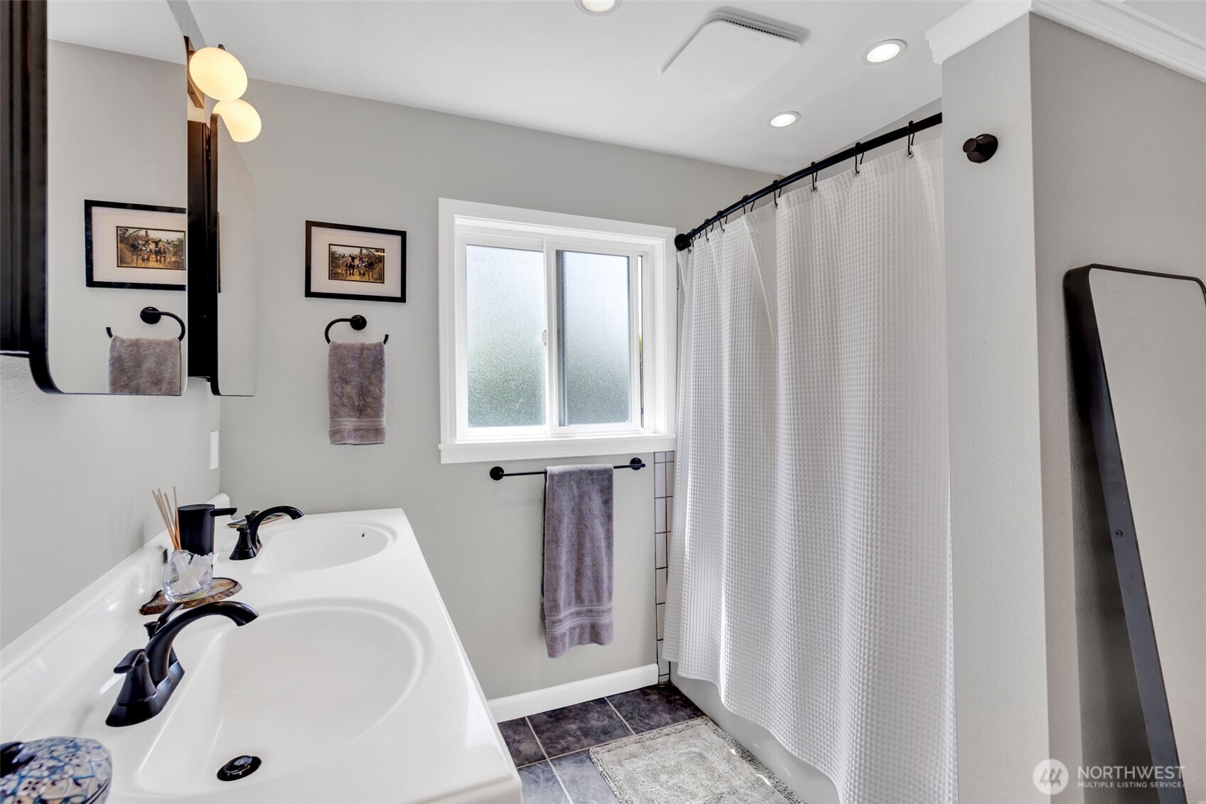 804 Electron Way Fircrest, WA 98466 - Photo 17 of 37 a bathroom with a sink and a tub