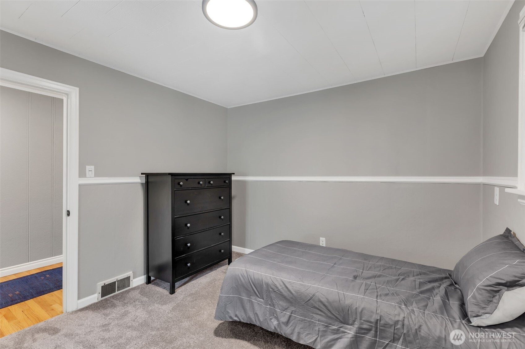 804 Electron Way Fircrest, WA 98466 - Photo 19 of 37 a bedroom with a bed and a cabinets