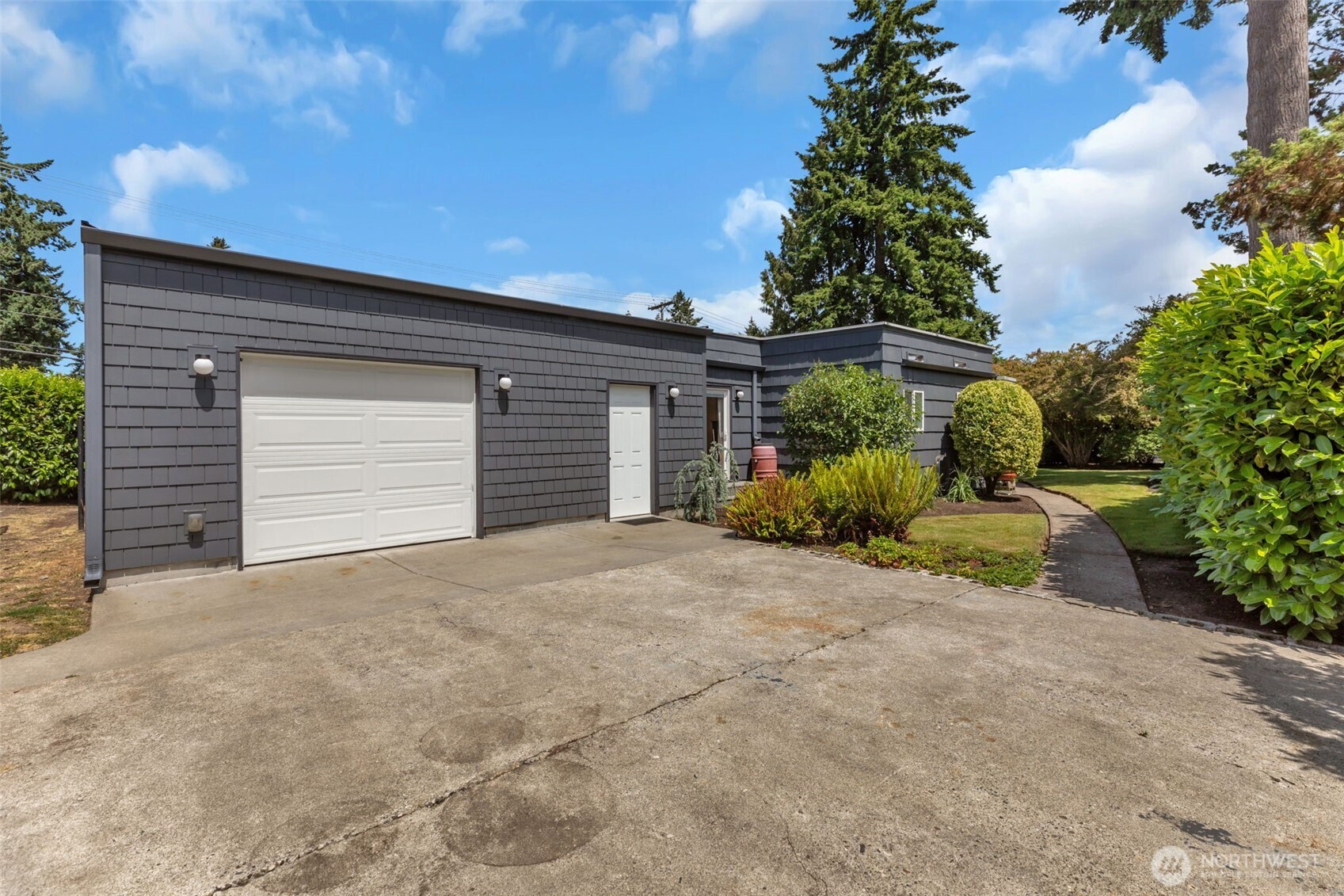 804 Electron Way Fircrest, WA 98466 - Photo 25 of 37 a front view of a house with a yard and garage