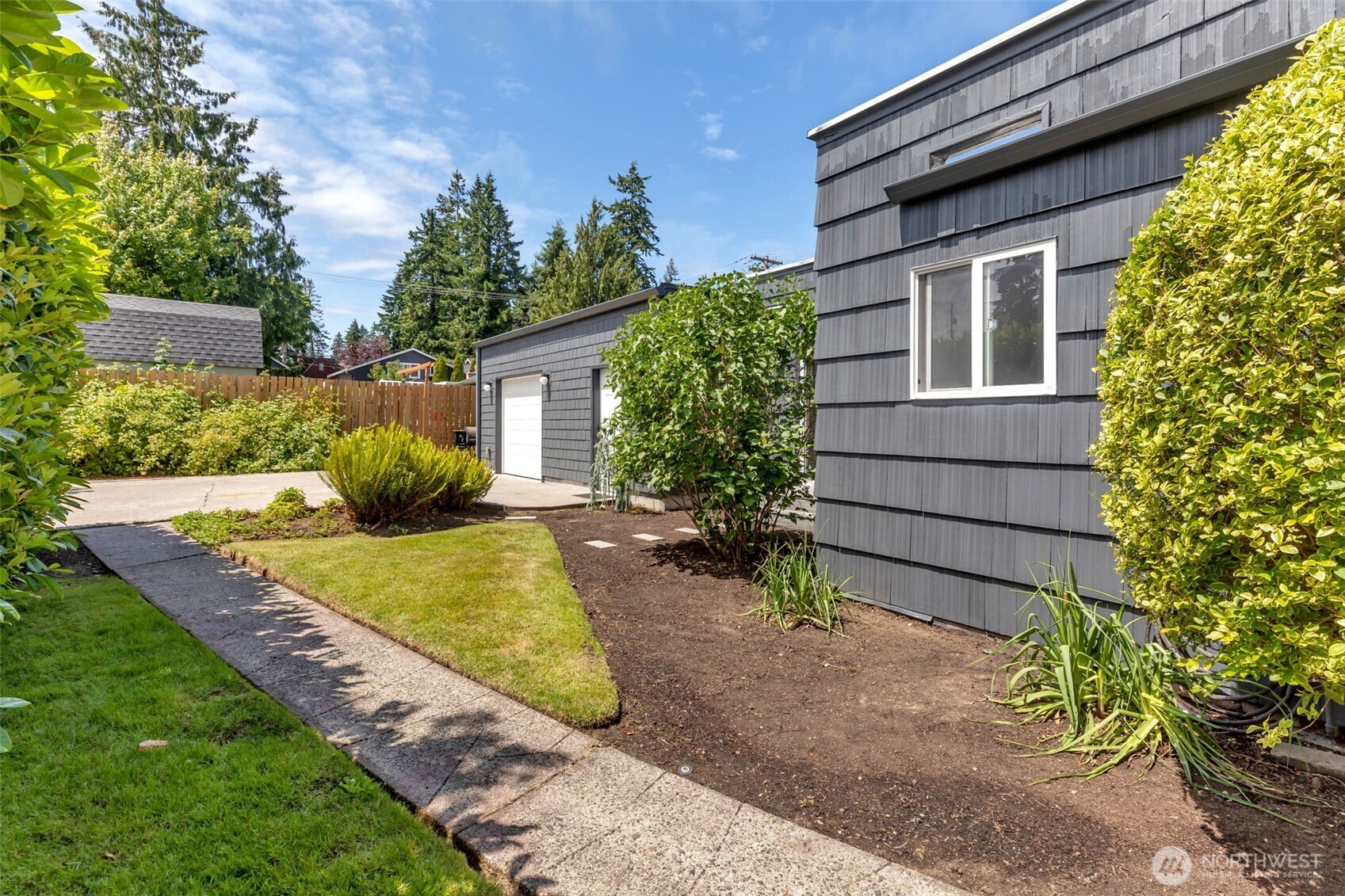 804 Electron Way Fircrest, WA 98466 - Photo 26 of 37 a view of a house with backyard and garden