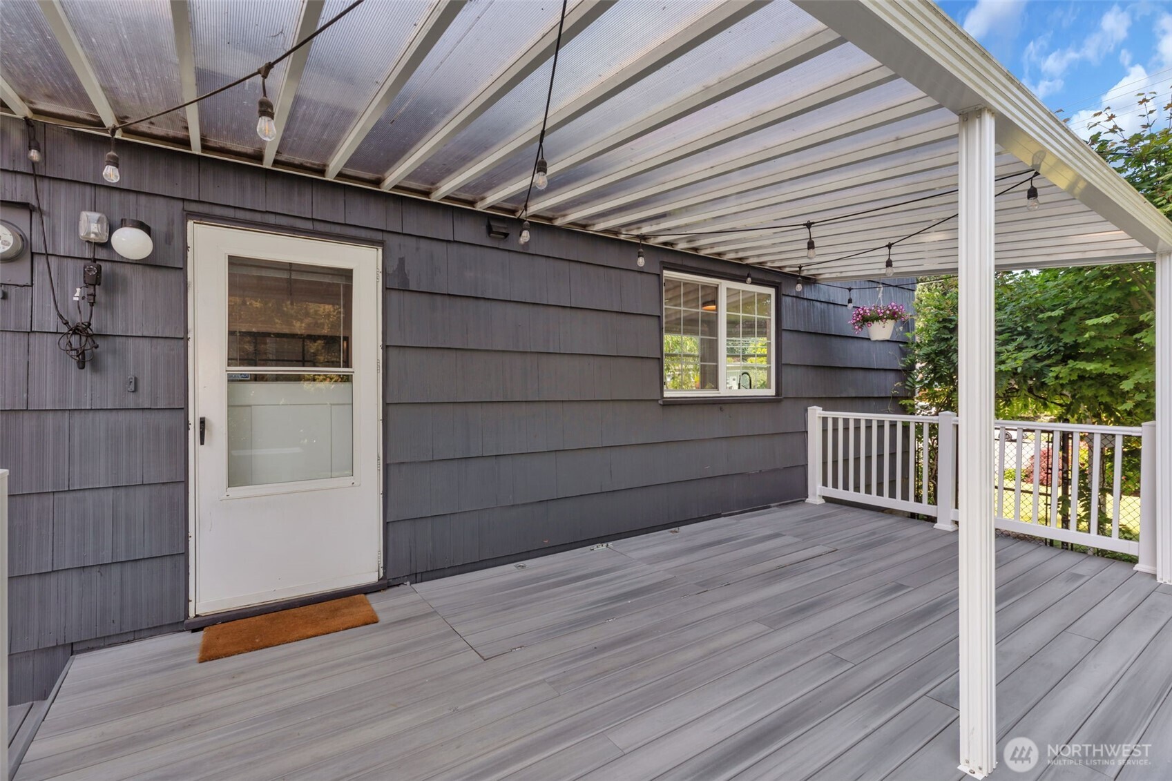 804 Electron Way Fircrest, WA 98466 - Photo 29 of 37 a view of backyard with wooden deck and floor to ceiling window