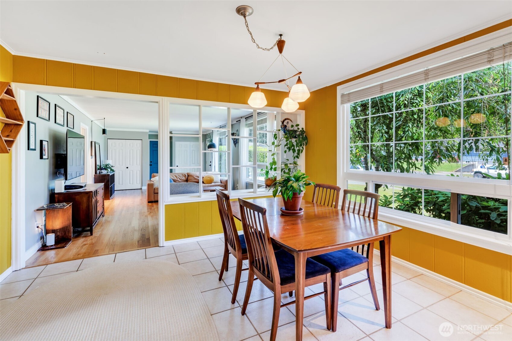 804 Electron Way Fircrest, WA 98466 - Photo 8 of 37 a dining room with furniture and a swimming pool