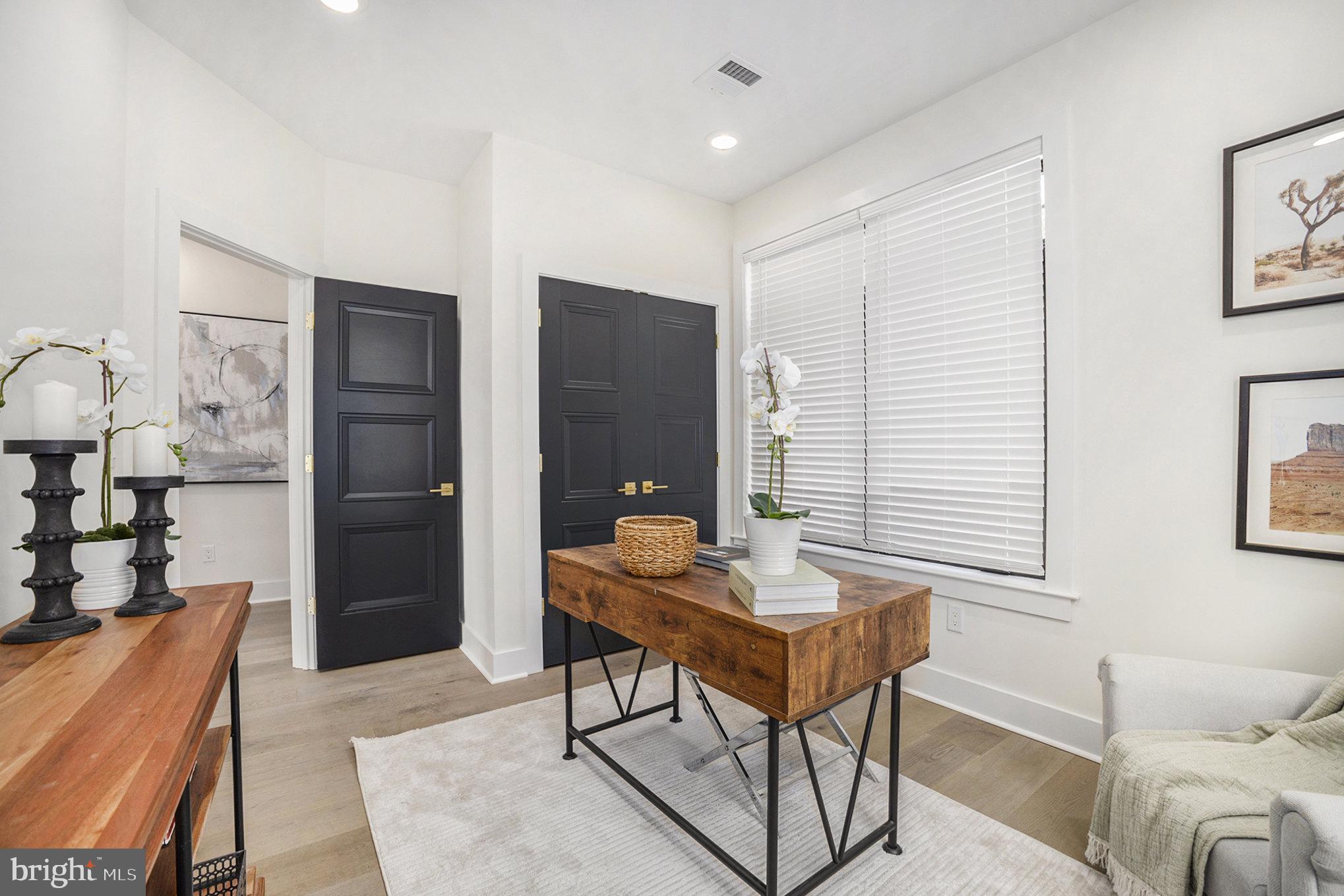 7519 Ridge Avenue, Unit 203 Philadelphia, PA 19128 - Photo 13 of 26 a workspace with furniture and window