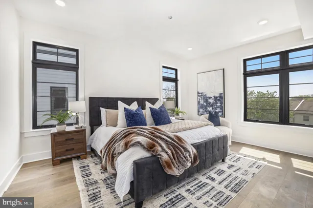 a bedroom with double bed and a window