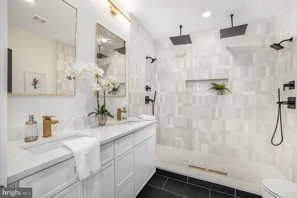 a bathroom with a sink and mirror