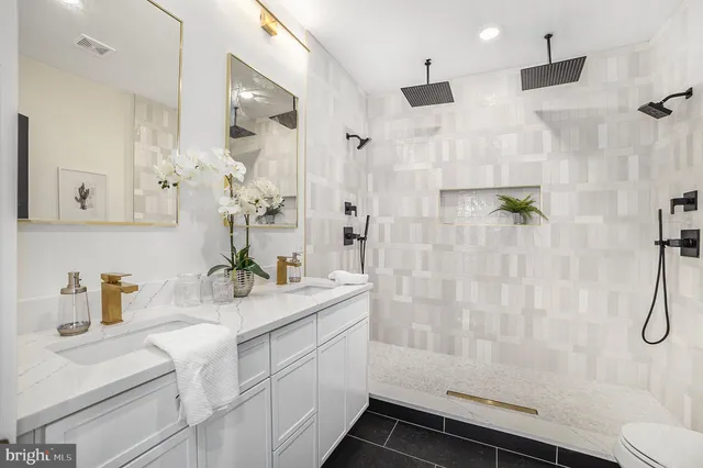 a bathroom with a sink and mirror