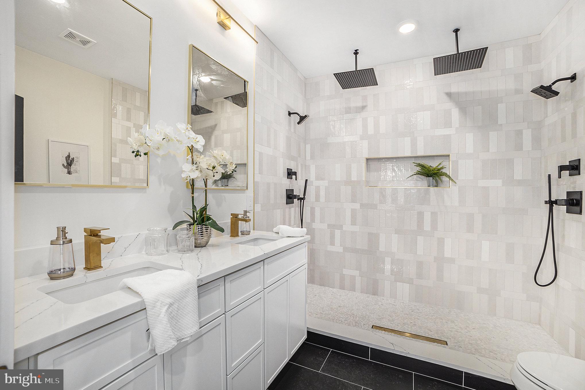 7519 Ridge Avenue, Unit 203 Philadelphia, PA 19128 - Photo 19 of 26 a bathroom with a sink and mirror