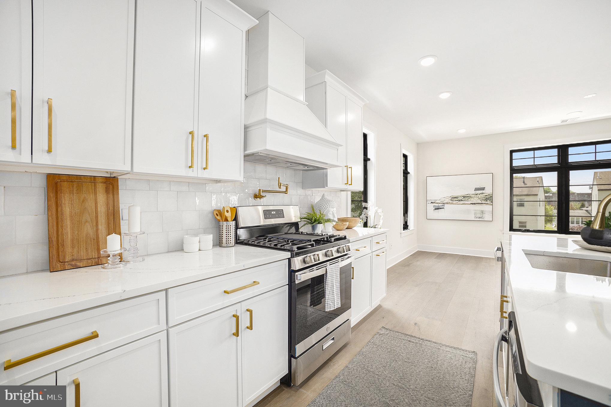 7519 Ridge Avenue, Unit 203 Philadelphia, PA 19128 - Photo 8 of 26 a kitchen with stainless steel appliances granite countertop a stove a sink and white cabinets