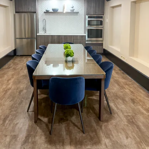 a view of a dining table and chairs in a room
