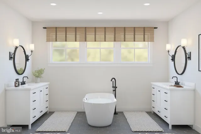 a bathroom with a sink mirror and window
