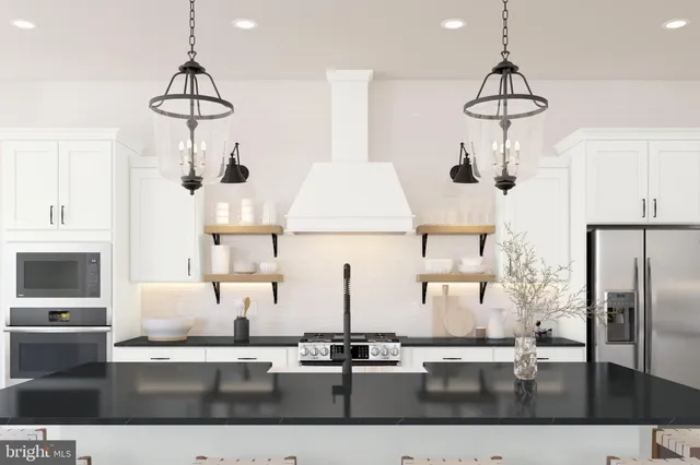 a kitchen with a refrigerator a sink and cabinets