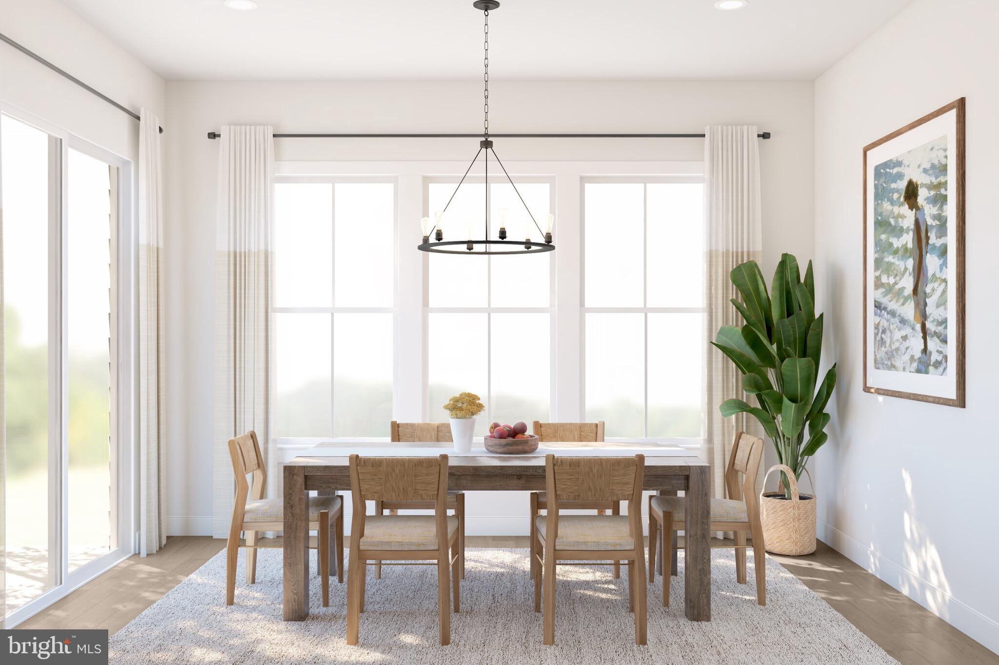 11948 Cygnet Street Lewes, DE 19958 - Photo 5 of 15 a dining room with furniture a chandelier and wooden floor