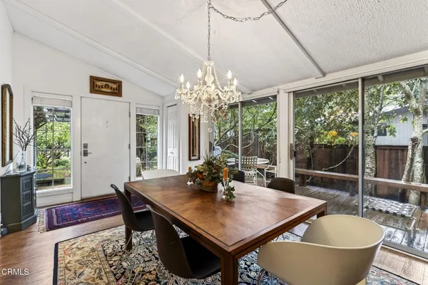 a view of a dining room with furniture window and wooden floor
