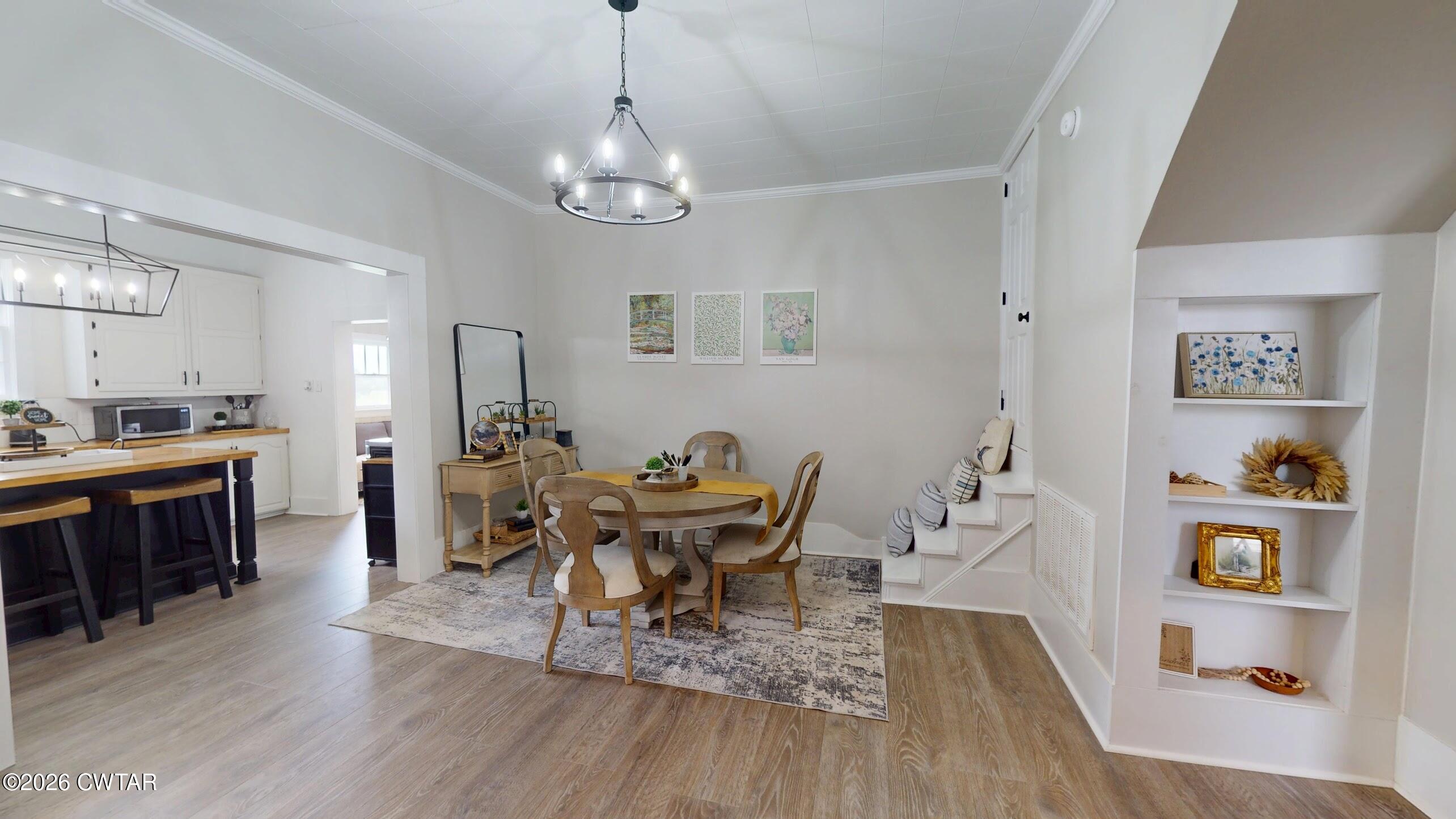 2800 Locust Grove Road Newbern, TN 38059 - Photo 13 of 46 a view of a dining room with furniture and wooden floor