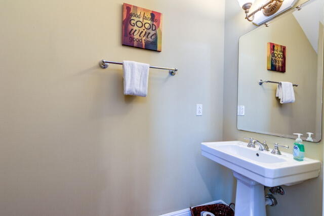 102 Anglers Way Islamorada, FL 33036 - Photo 18 of 36 a bathroom with a sink and a mirror