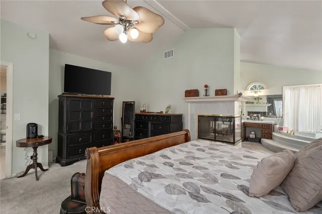 a bed room with a bed and a television