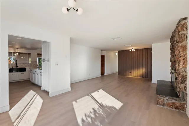 a kitchen with stainless steel appliances a stove microwave and cabinets