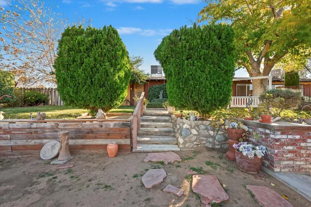 a view of a house with a backyard