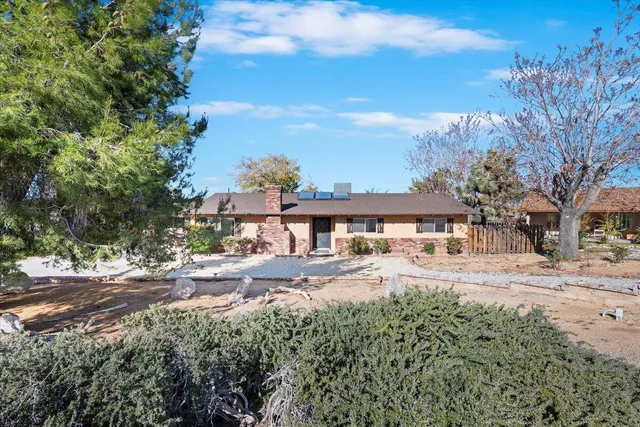 a view of a street with a cars parked