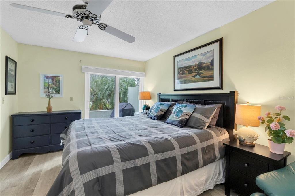 2828 Sherbrooke Lane, Unit C Palm Harbor, FL 34684 - Photo 11 of 40 a bedroom with a bed and a window