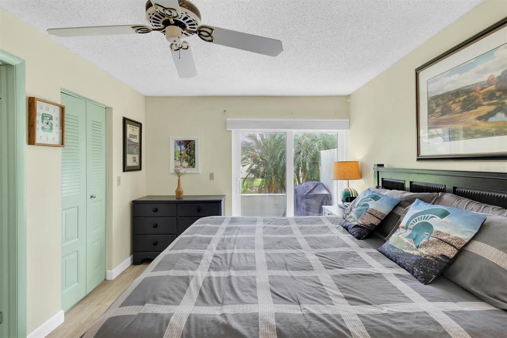 2828 Sherbrooke Lane, Unit C Palm Harbor, FL 34684 - Photo 13 of 40 a bedroom with a bed and window