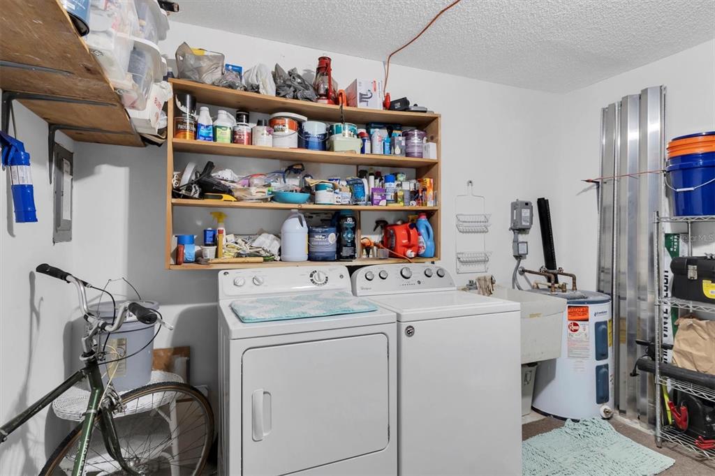 2828 Sherbrooke Lane, Unit C Palm Harbor, FL 34684 - Photo 18 of 40 a view of walk in closet with clothes and shoes