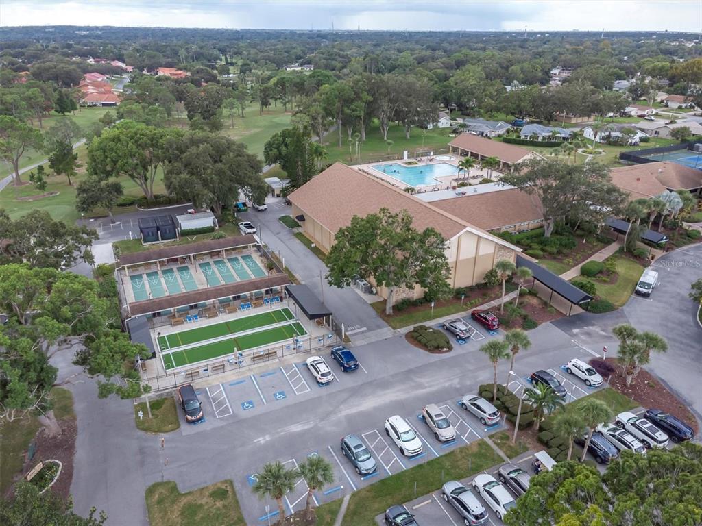 2828 Sherbrooke Lane, Unit C Palm Harbor, FL 34684 - Photo 25 of 40 an aerial view of a house with a garden