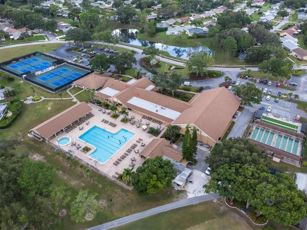2828 Sherbrooke Lane, Unit C Palm Harbor, FL 34684 - Photo 26 of 40 an aerial view of residential houses with outdoor space