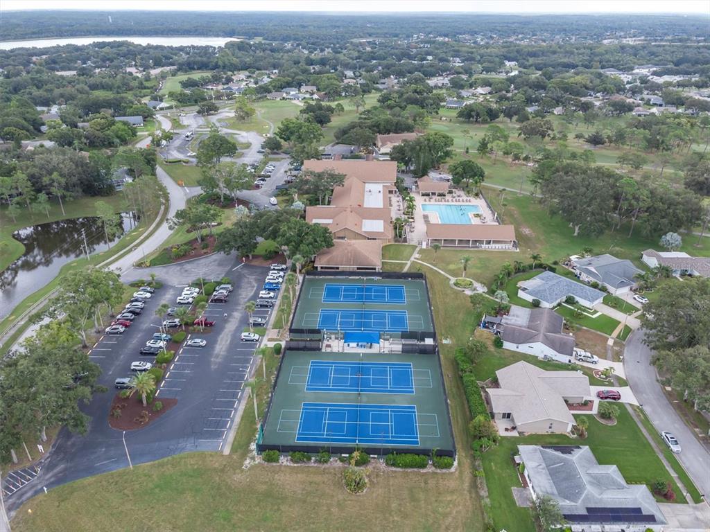 2828 Sherbrooke Lane, Unit C Palm Harbor, FL 34684 - Photo 27 of 40 an aerial view of residential houses with outdoor space