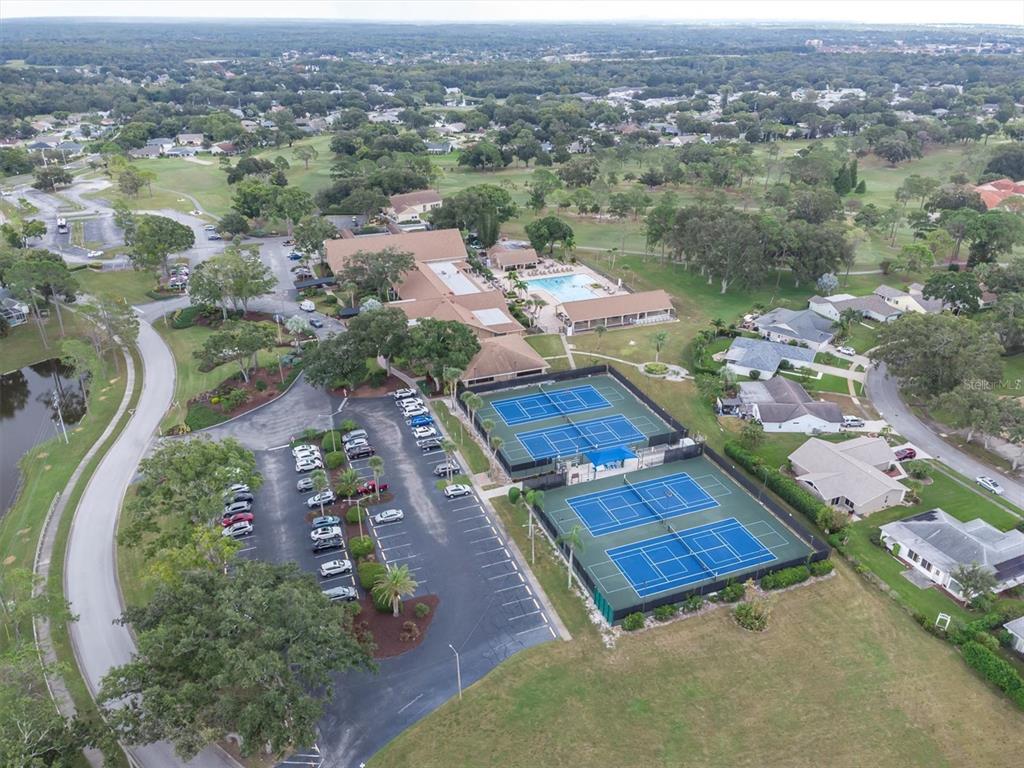 2828 Sherbrooke Lane, Unit C Palm Harbor, FL 34684 - Photo 28 of 40 an aerial view of a house with a garden