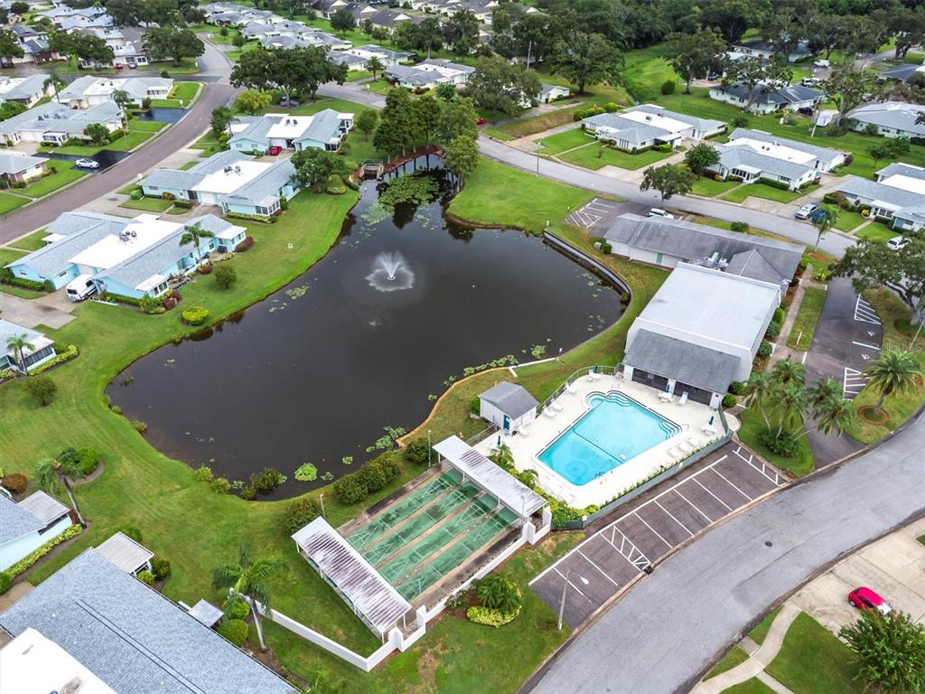 2828 Sherbrooke Lane, Unit C Palm Harbor, FL 34684 - Photo 31 of 40 an aerial view of a house with a garden