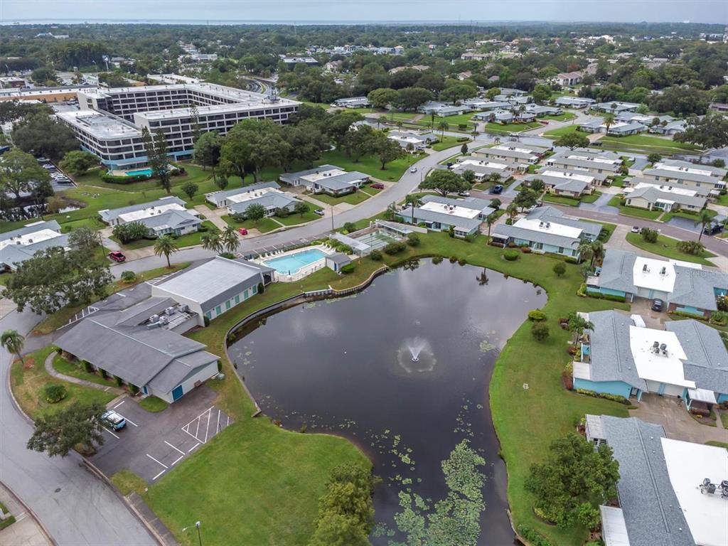 2828 Sherbrooke Lane, Unit C Palm Harbor, FL 34684 - Photo 32 of 40 an aerial view of residential houses with outdoor space