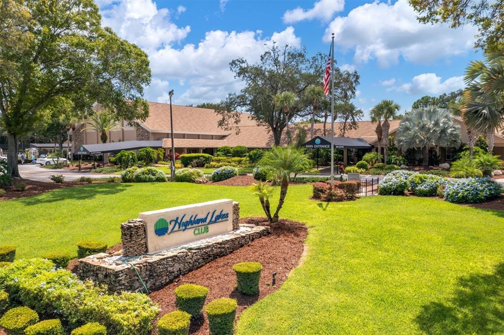 2828 Sherbrooke Lane, Unit C Palm Harbor, FL 34684 - Photo 36 of 40 a swimming pool with outdoor seating and yard