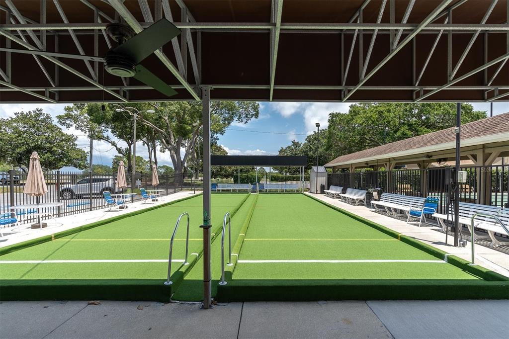 2828 Sherbrooke Lane, Unit C Palm Harbor, FL 34684 - Photo 37 of 40 a view of a backyard with a small swimming pool