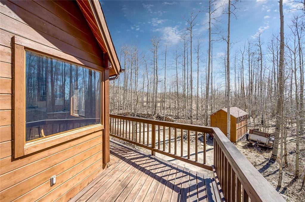 1579 Sheep Ridge Road Fairplay, CO 80440 - Photo 34 of 35 a view of balcony with wooden floor and outdoor seating
