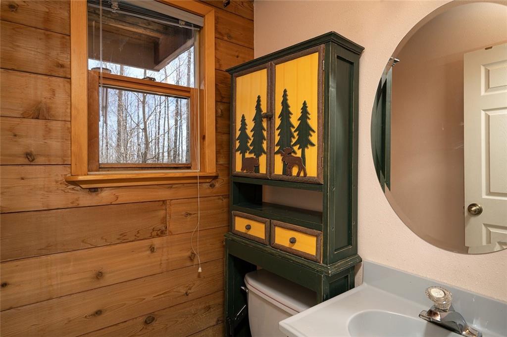 1579 Sheep Ridge Road Fairplay, CO 80440 - Photo 9 of 35 a bathroom with a sink a mirror and a shower