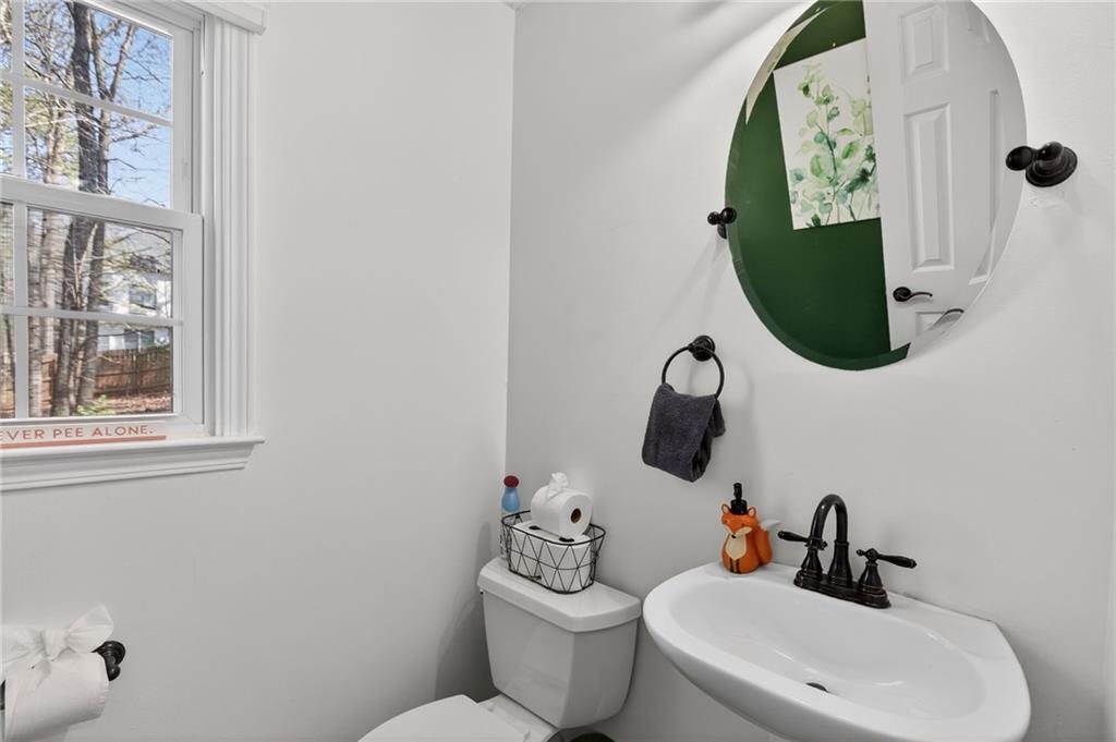 53 Crestview Drive Dallas, GA 30157 - Photo 12 of 46 a bathroom with a toilet sink and mirror