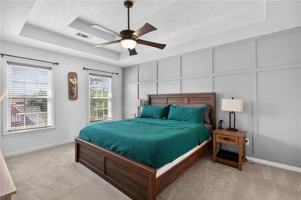 53 Crestview Drive Dallas, GA 30157 - Photo 19 of 46 a bed sitting in a bedroom next to a window and a chandelier